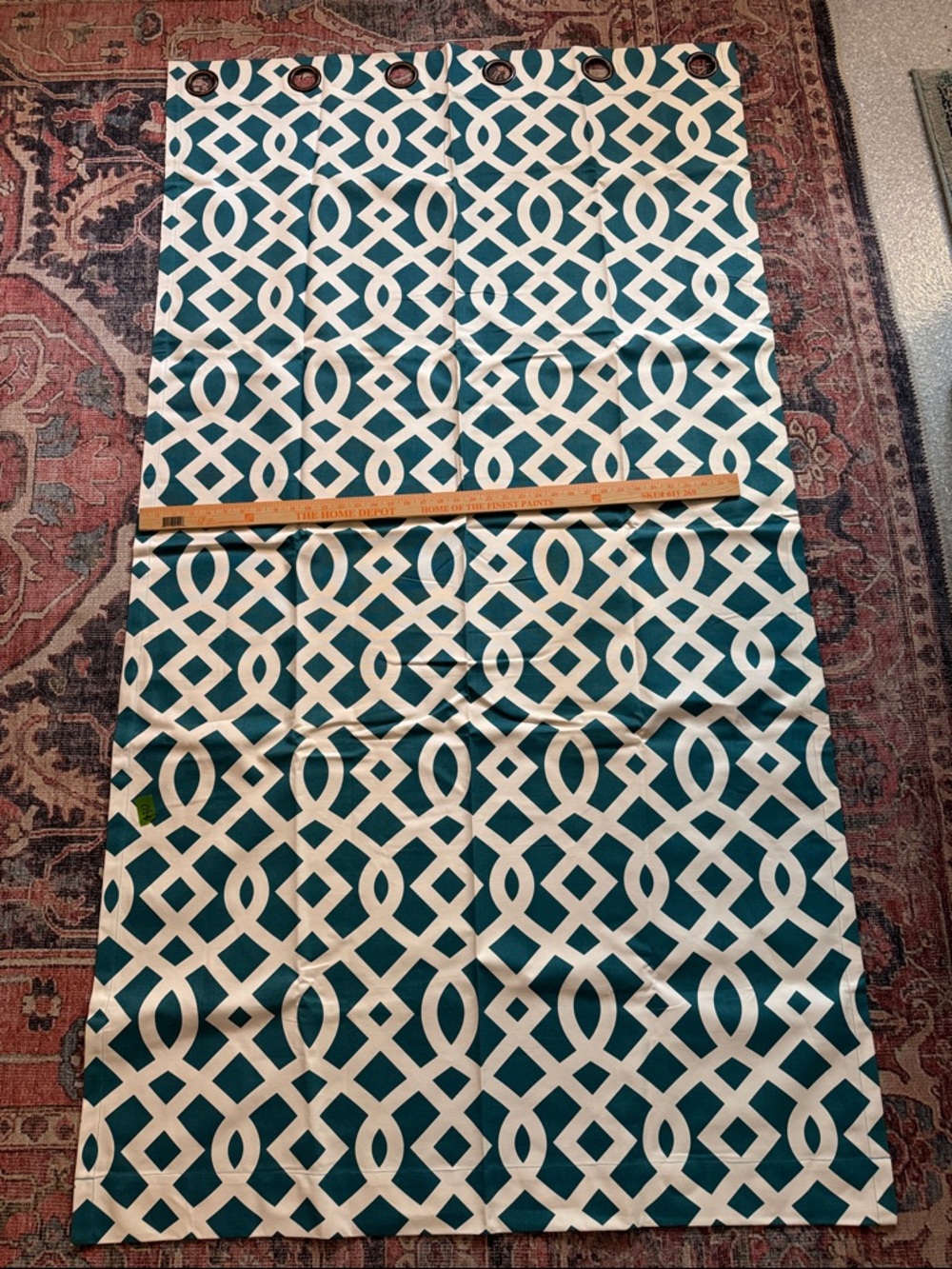Pair of teal and white geometric patterned drapes  40”x 73”